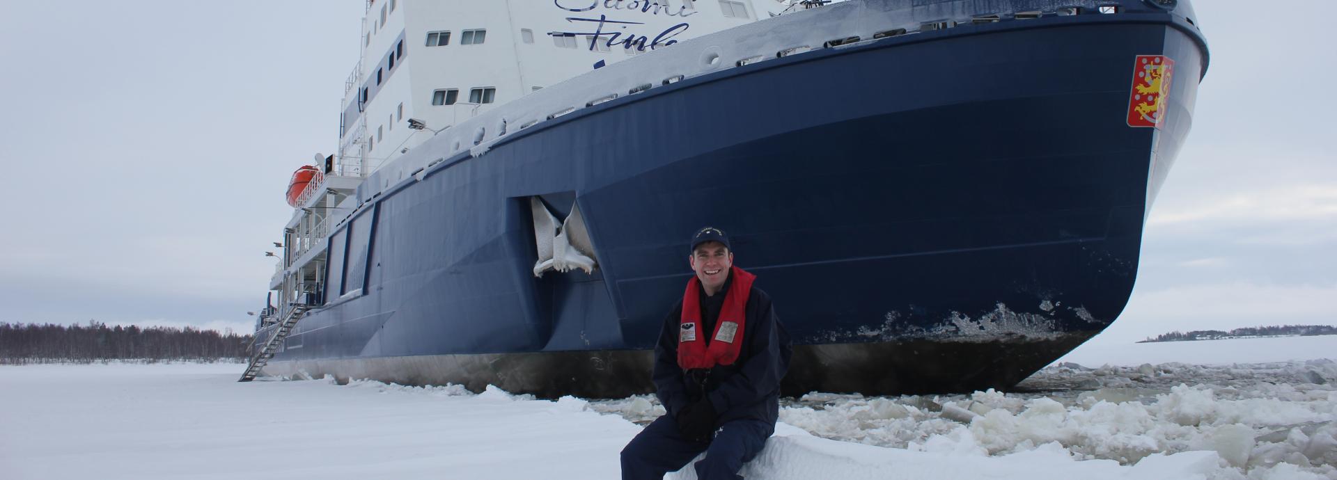 Fulbright Finland Mid-Career Professional Development program participant in front of a Finnish icebreaker.