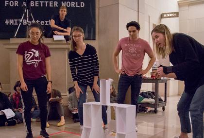 ASLA-Fulbright Pre-doctoral grantee Antti Surma-aho observing students at an engineering class at MIT. The six students are testing a device they built.