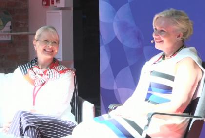 Fulbright Finland Foundation CEO and the Chair of the Foundation's Board of Directors Piia Björn smilingly discussing at SuomiAreena. 