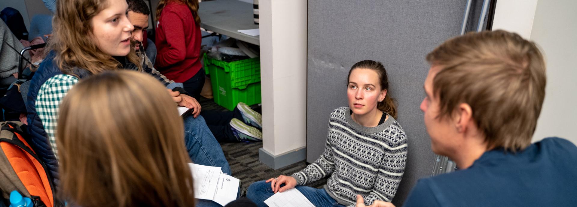 Group of MIT students discussing intensily