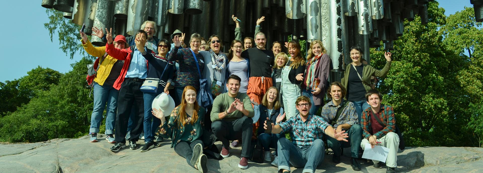 2018-2019 U.S. Fulbrighters waving at the Sibelius Monument in Helsinki