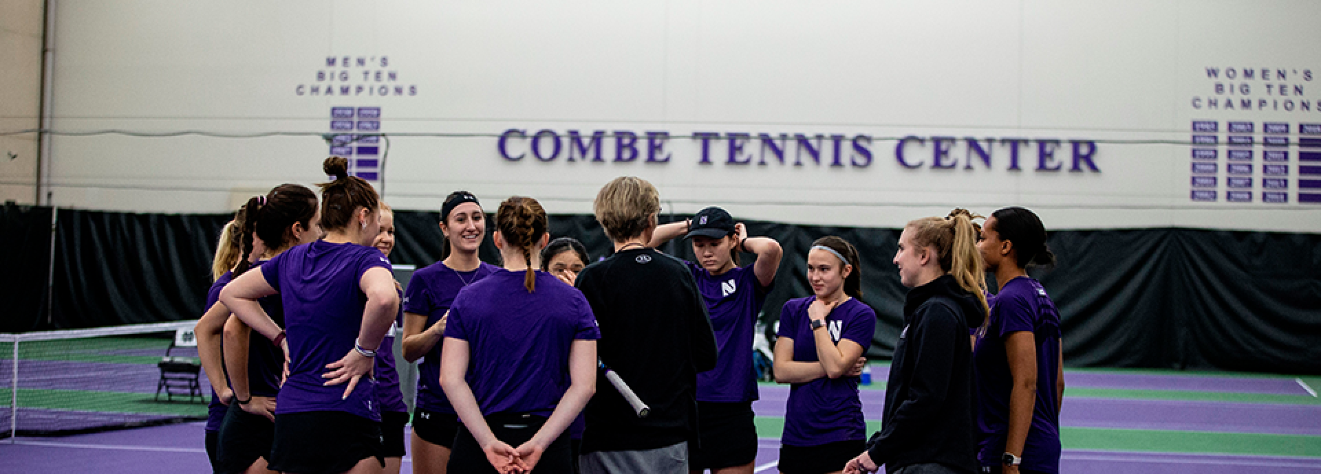 Aino Alkio with her Tennis team at a sports hall