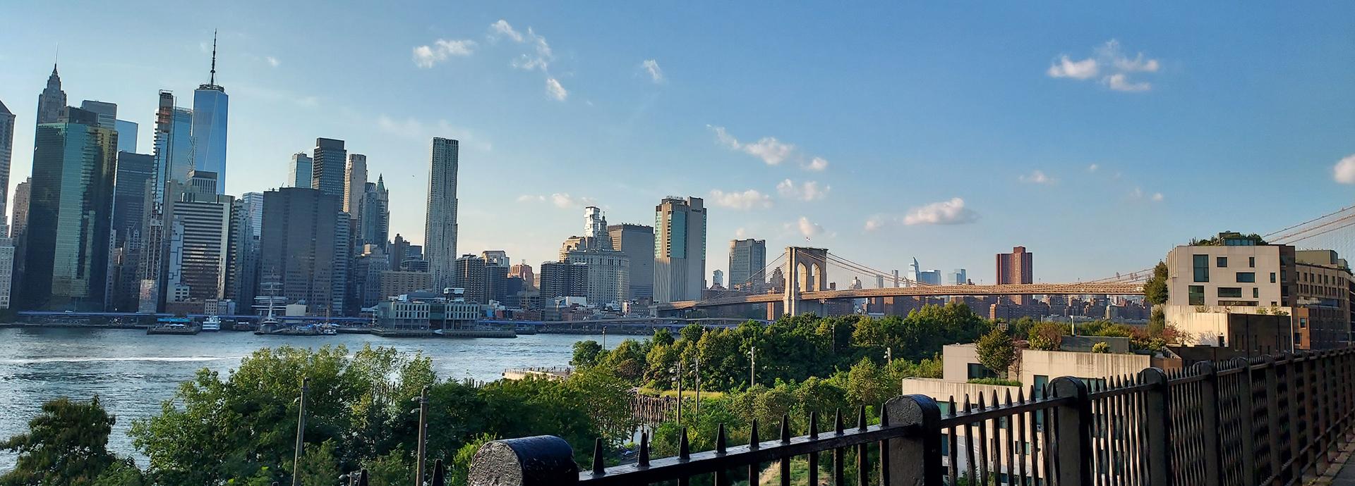 Panorama photo of NYC skyline and Brooklyn Bridge