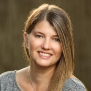 Photo of a woman in a grey shirt