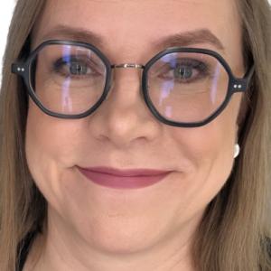 Photo of a woman with glasses and long light hair